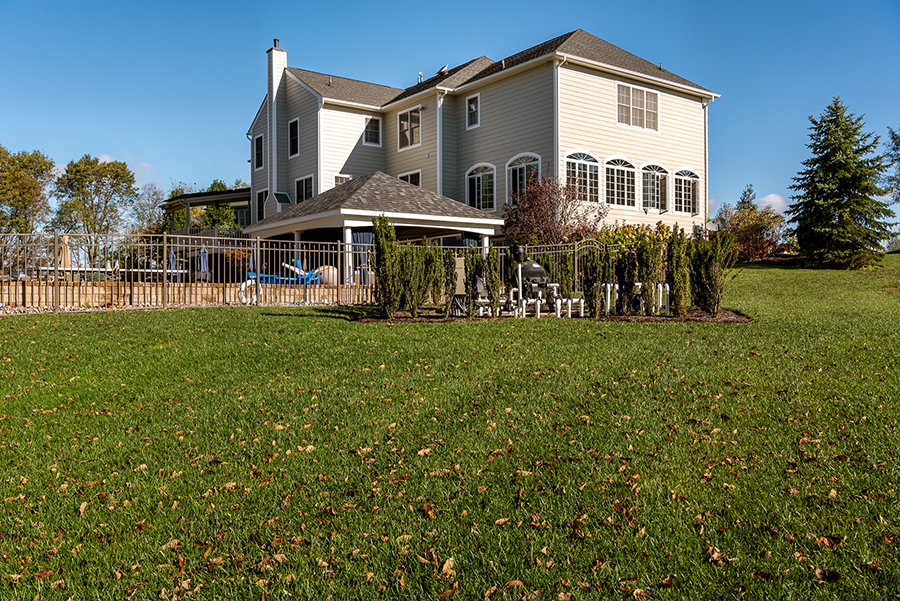 Glick's grey vinyl siding compliments brick exterior very well